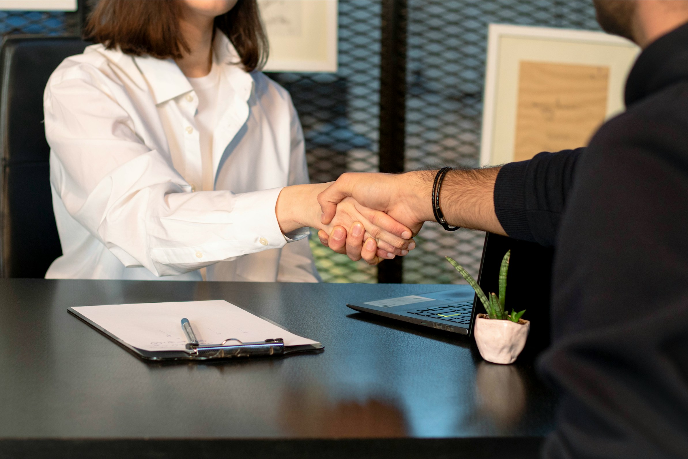 Business handshake over a desk during a meeting