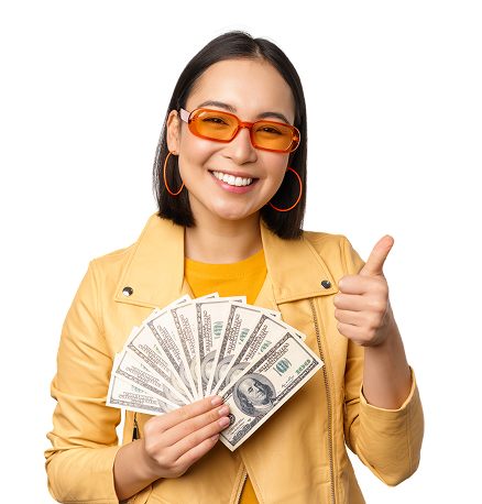 Smiling woman holding money giving a thumbs up